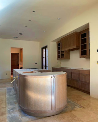 Custom Cerused Oak Kitchen Island with Curved Doors