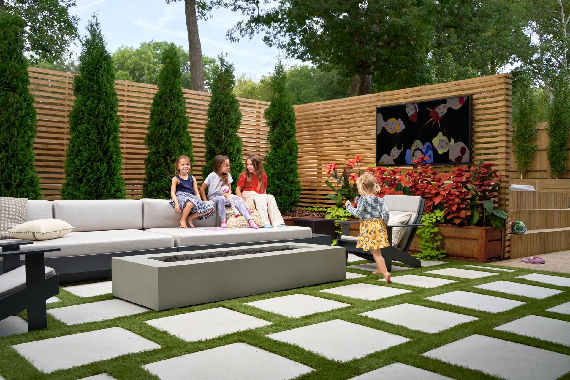 Family on the Outdoor Patio with Privacy Wall Open to the Kitchen